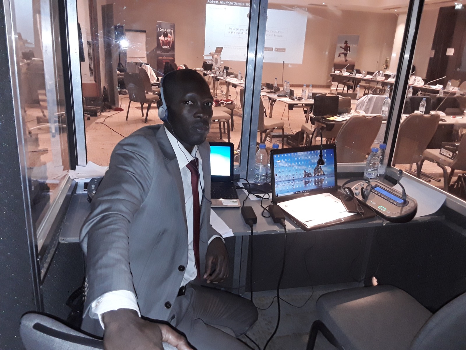 TRANSLAB INTERNATIONAL professional interpreter in an interpretation booth