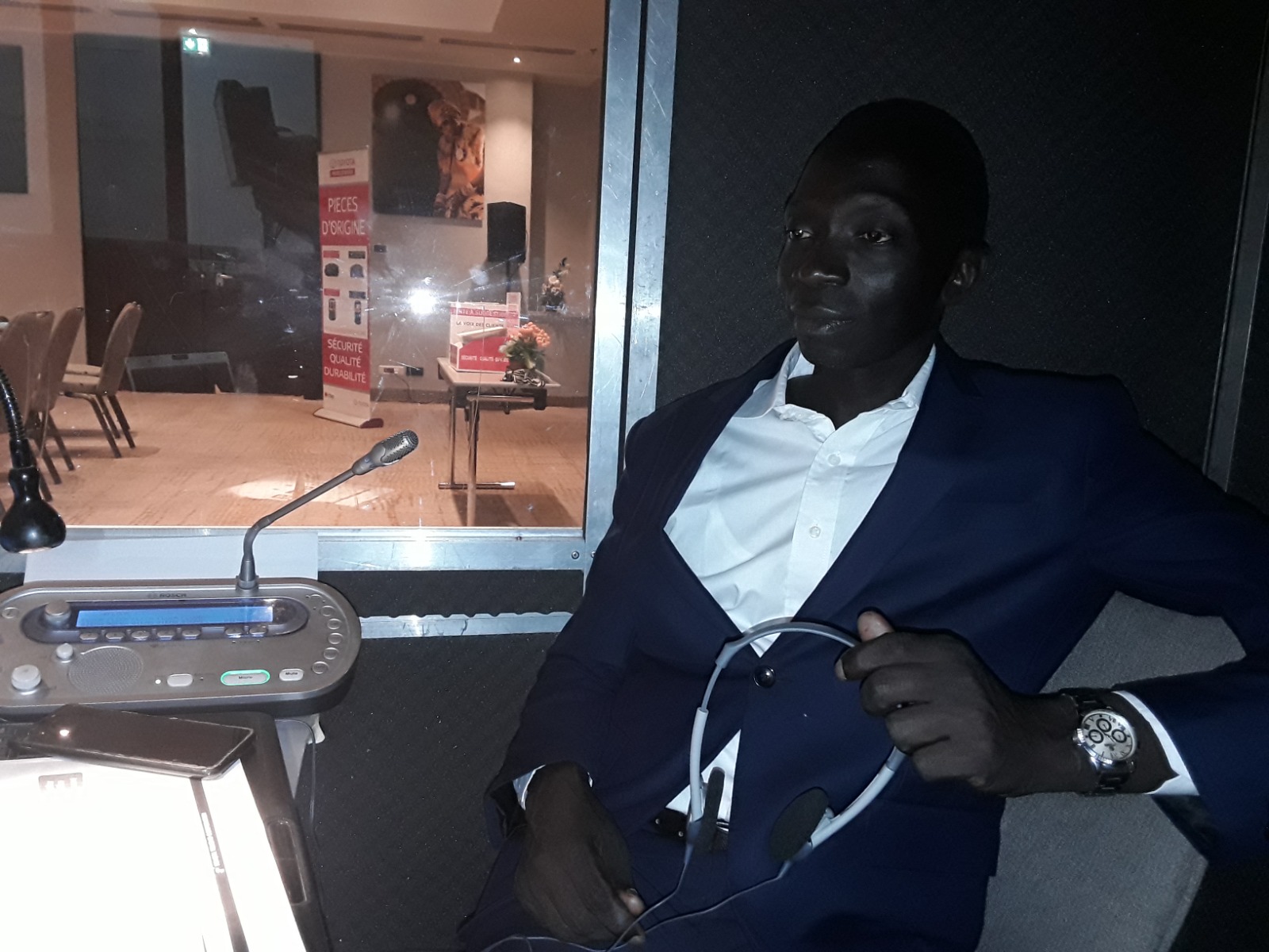 Professional interpreter with headset in the interpretation booth
