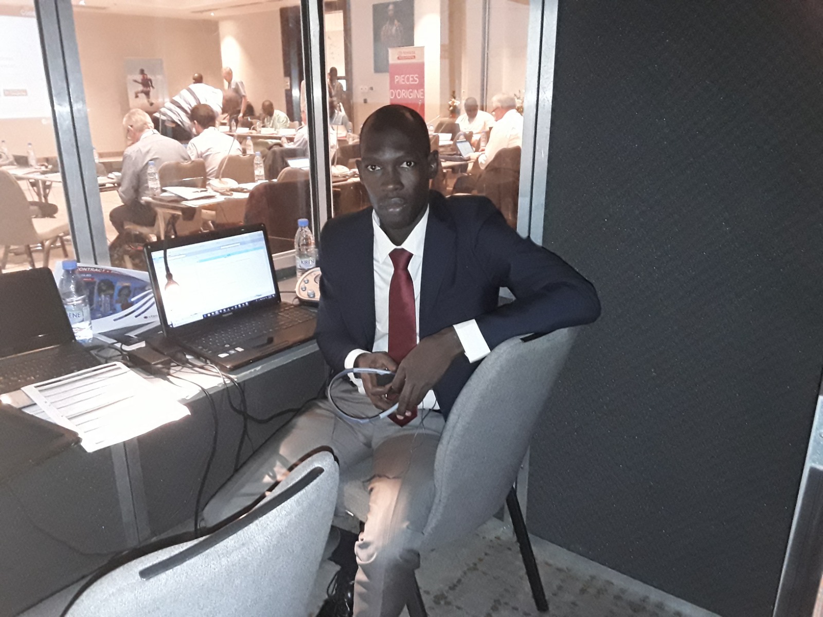 Professional interpreter in a suit in the interpretation booth