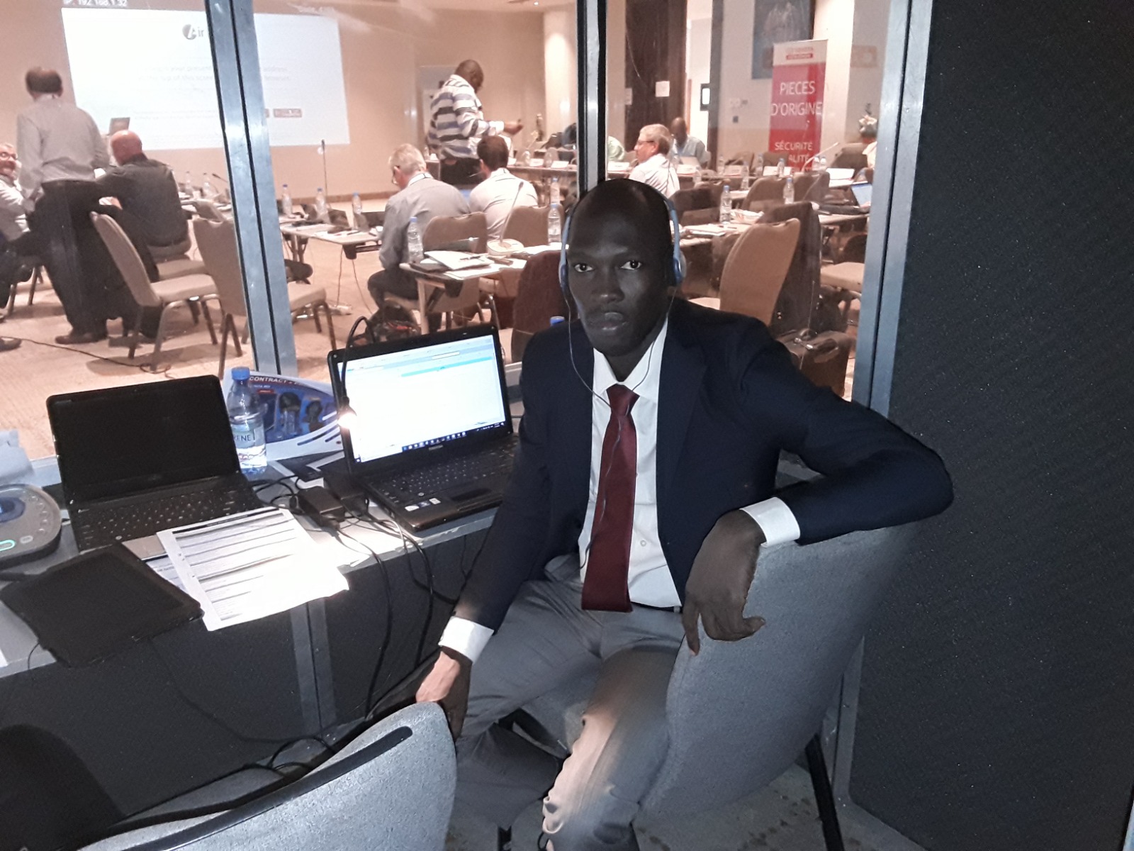 Interpreter with headset in the interpretation booth